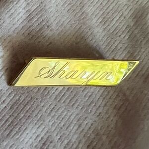 Vintage - gold tone pin - “Sharyn”